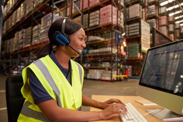 woman in warehouse with headset